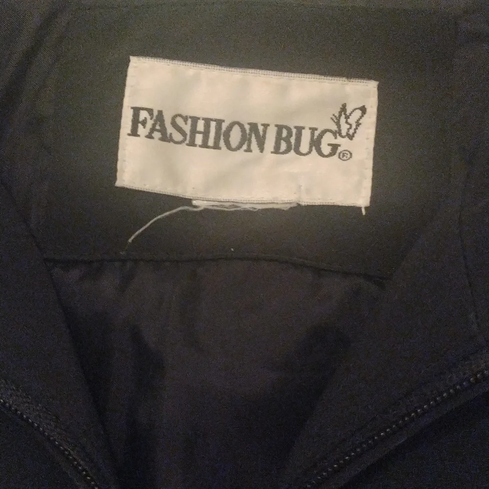 -Black water resistant flap front pockets snap cuffs hooded zip up raincoat